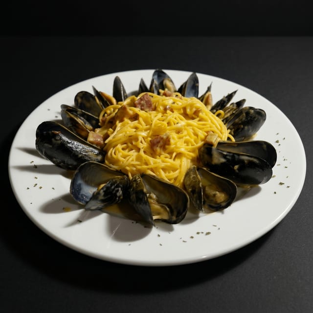 Mussels Saffron over pasta.